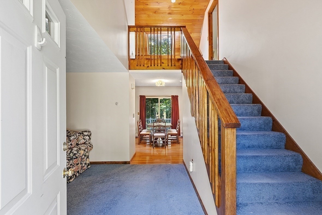 58 Peabody Road, Unit B Shirley, MA 01464 - Photo 28 of 38 a view of a hallway with wooden floor and entryway
