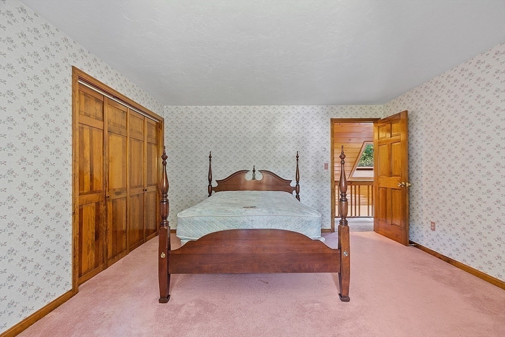 58 Peabody Road, Unit B Shirley, MA 01464 - Photo 32 of 38 a bedroom with a bed and a window