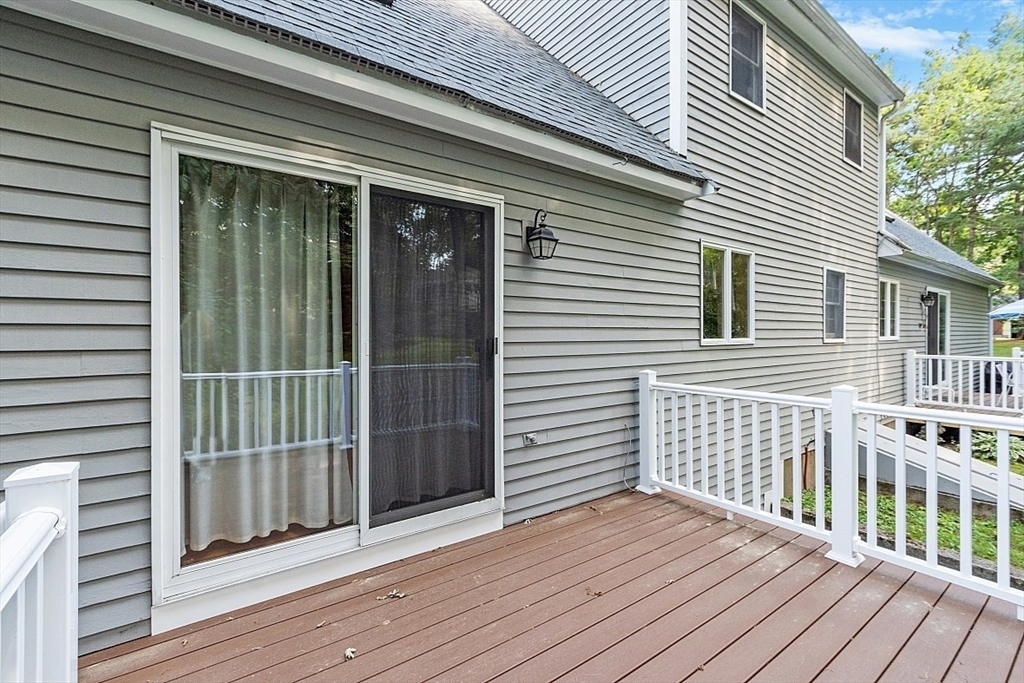 58 Peabody Road, Unit B Shirley, MA 01464 - Photo 35 of 38 a view of a wooden deck