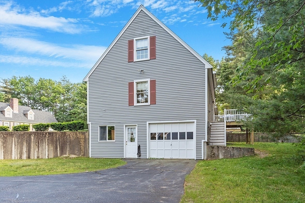 58 Peabody Road, Unit B Shirley, MA 01464 - Photo 5 of 38 a view of a house with a yard