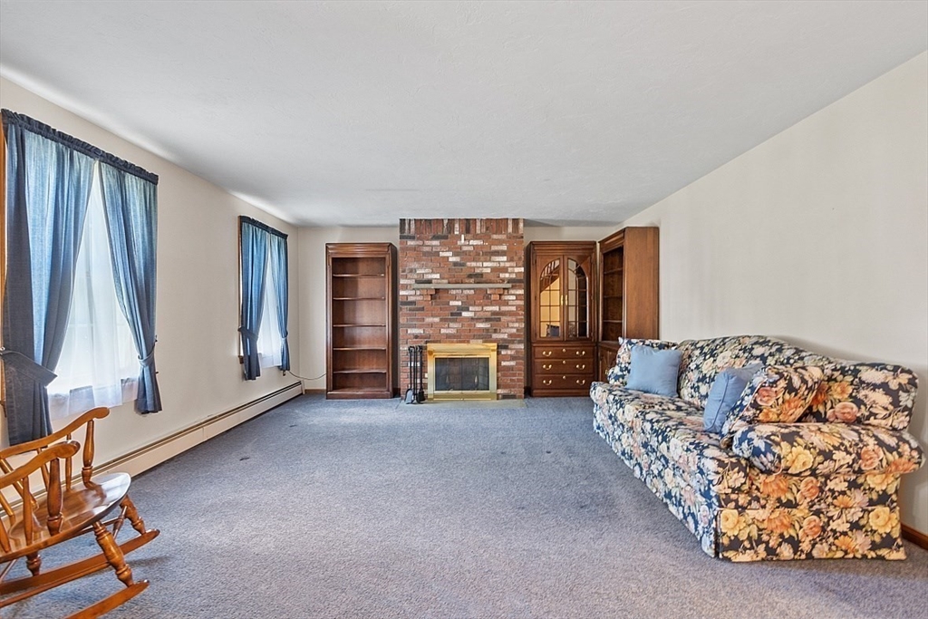 58 Peabody Road, Unit B Shirley, MA 01464 - Photo 7 of 38 a view of livingroom with furniture and window