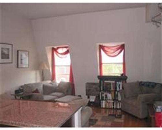 346 West 3rd Street, Unit 21 Boston, MA 02127 - Photo 2 of 11 a living room with furniture and a flat screen tv