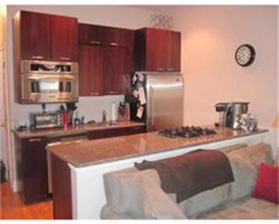 346 West 3rd Street, Unit 21 Boston, MA 02127 - Photo 3 of 11 a kitchen with refrigerator and cabinets