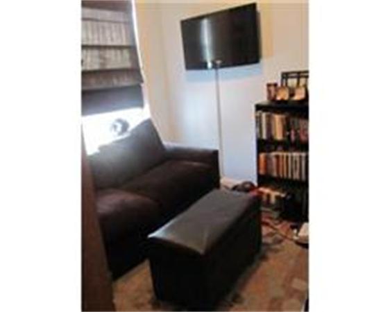 346 West 3rd Street, Unit 21 Boston, MA 02127 - Photo 5 of 11 a living room with furniture and a flat screen tv