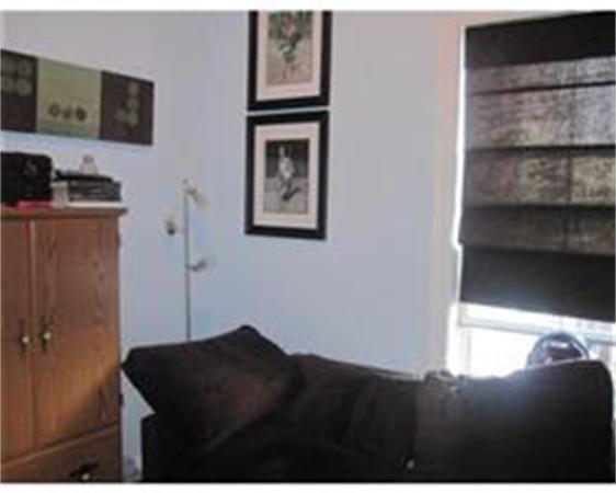 346 West 3rd Street, Unit 21 Boston, MA 02127 - Photo 6 of 11 a bedroom with a bed and a cabinets