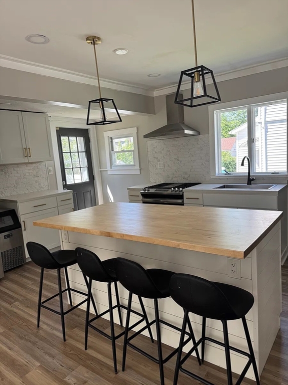 36 Sunapee Street Springfield, MA 01108 - Photo 2 of 18 a kitchen with a table chairs and white cabinets