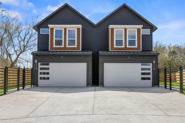 a front view of a house with a garage