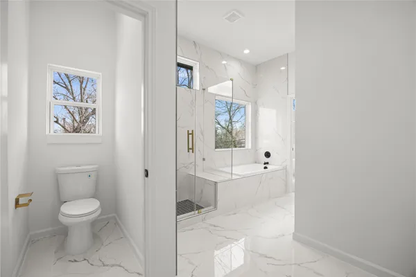 a large white room with toilet