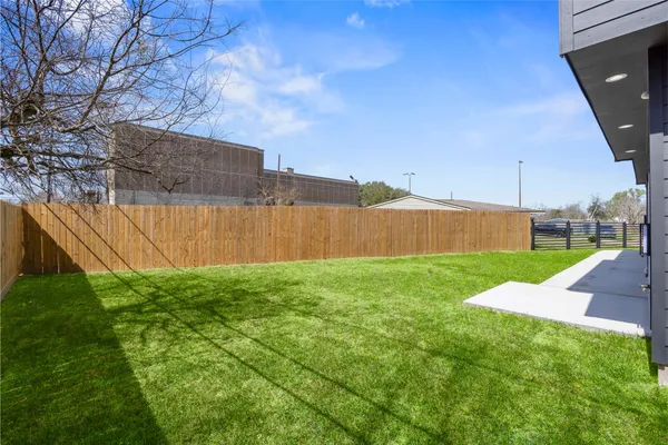 a view of a backyard with a small cabin