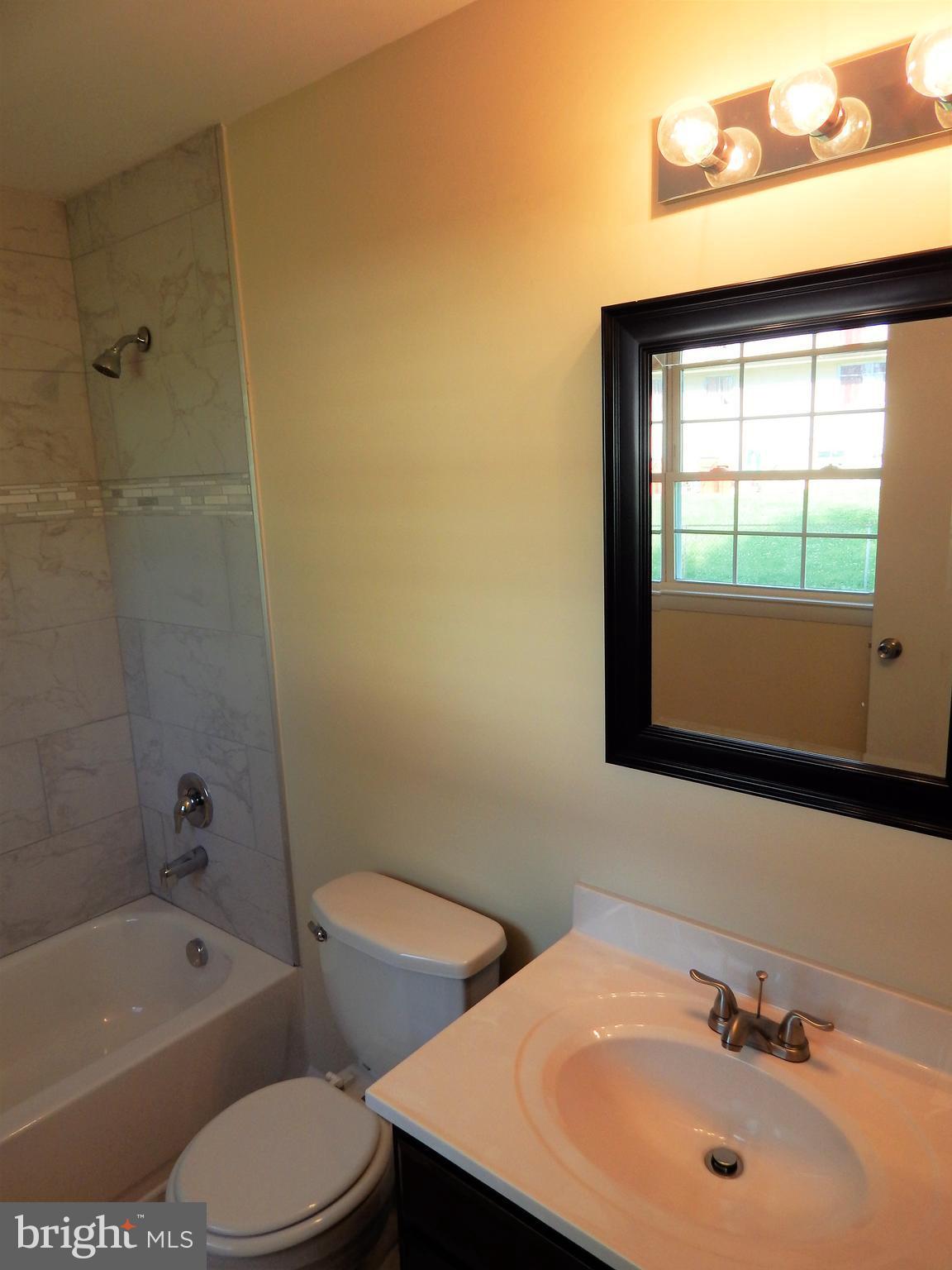 138 Lemon Road Ranson, WV 25438 - Photo 20 of 29 a bathroom with a sink a toilet and shower