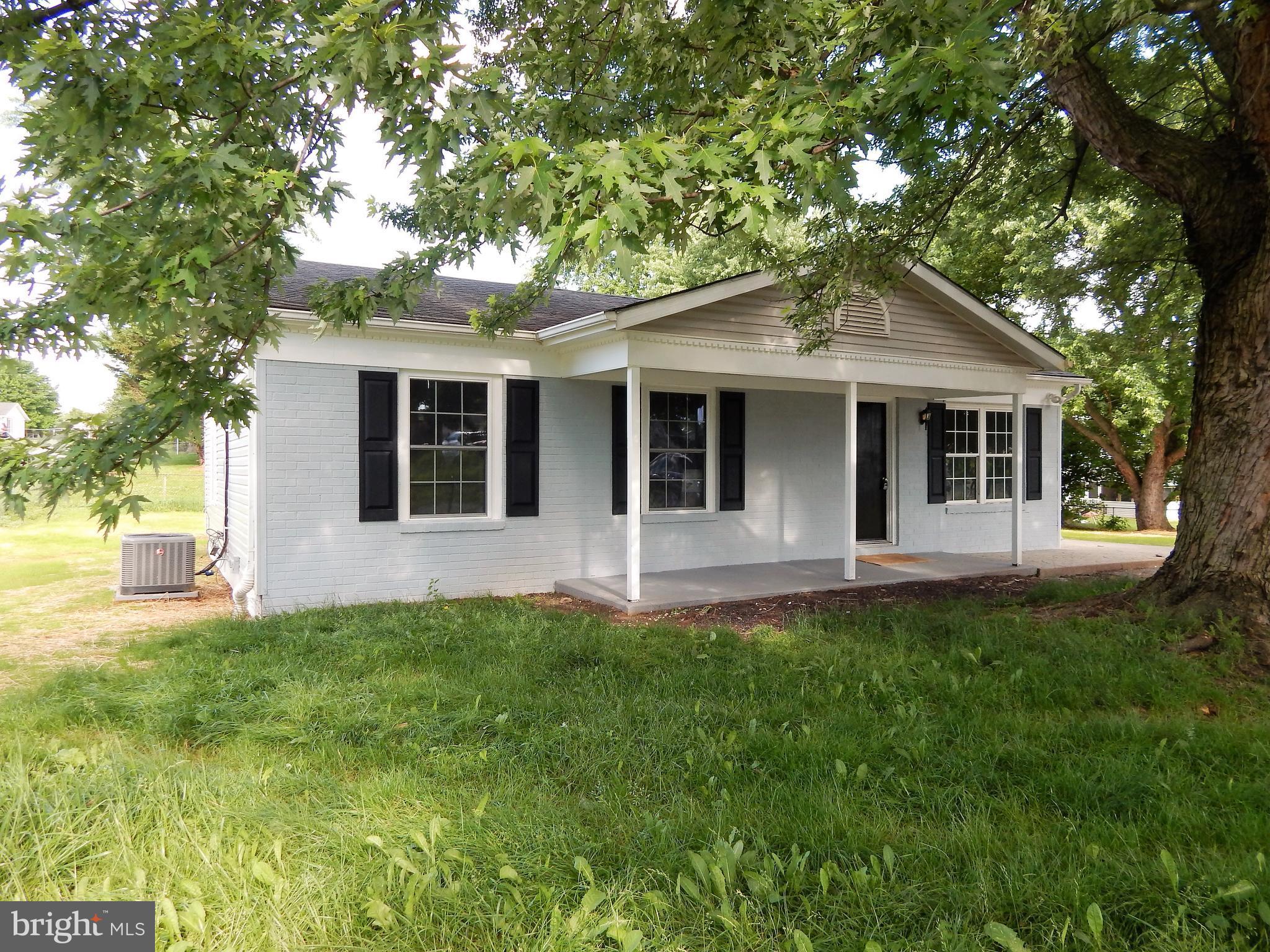 138 Lemon Road Ranson, WV 25438 - Photo 29 of 29 a front view of a house with a garden