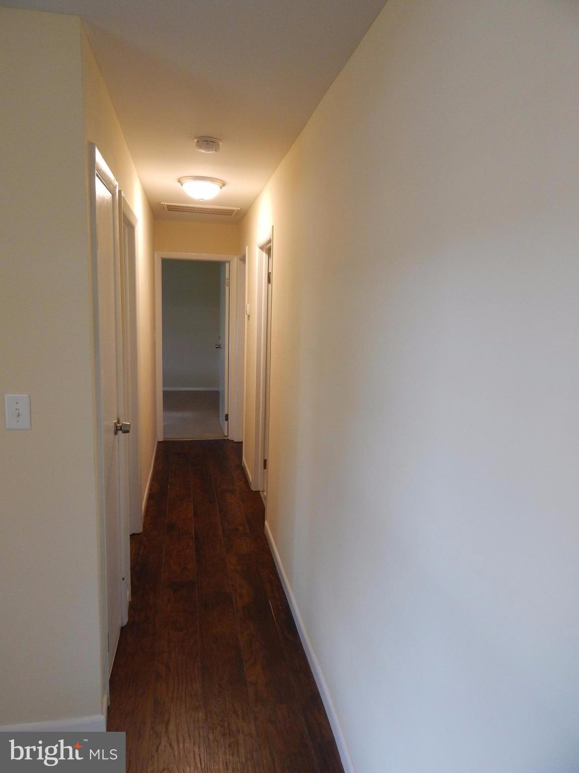 138 Lemon Road Ranson, WV 25438 - Photo 10 of 29 a view of a hallway with wooden floor