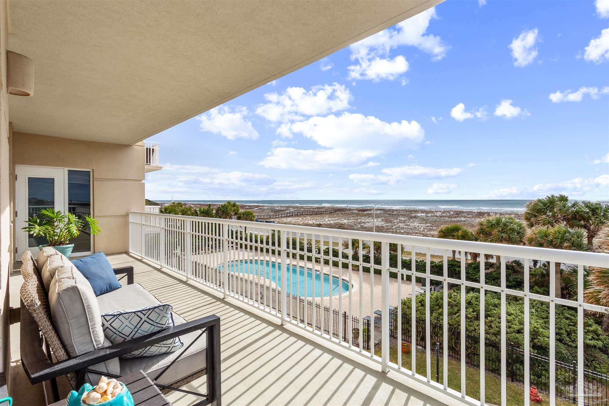 800 Fort Pickens Road, Unit 204 Pensacola Beach, FL 32561 - Photo 2 of 45 a view of a chairs and tables in the balcony