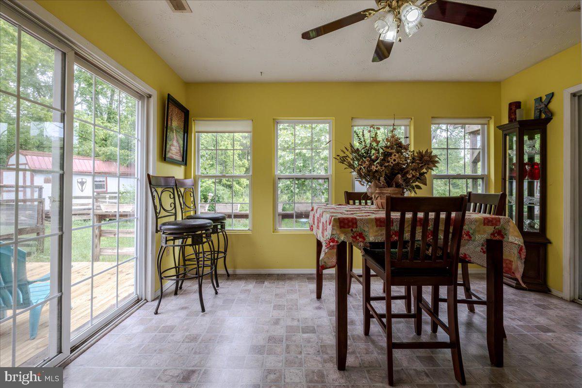 11419 Oak Grove Road Bristol, VA 24202 - Photo 13 of 36 a view of a dining room with furniture window and outside view