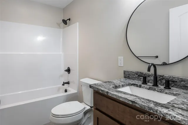 a view of a backyard with pathway