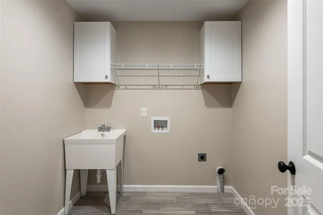 a backyard of a house with lots of green space and a fountain