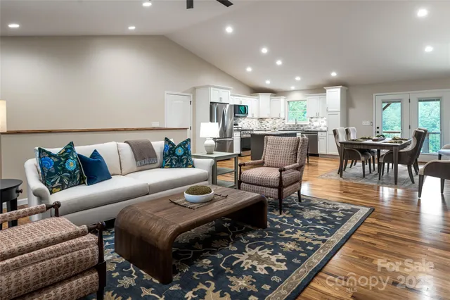 a kitchen with stainless steel appliances granite countertop counter space a sink refrigerator and cabinets