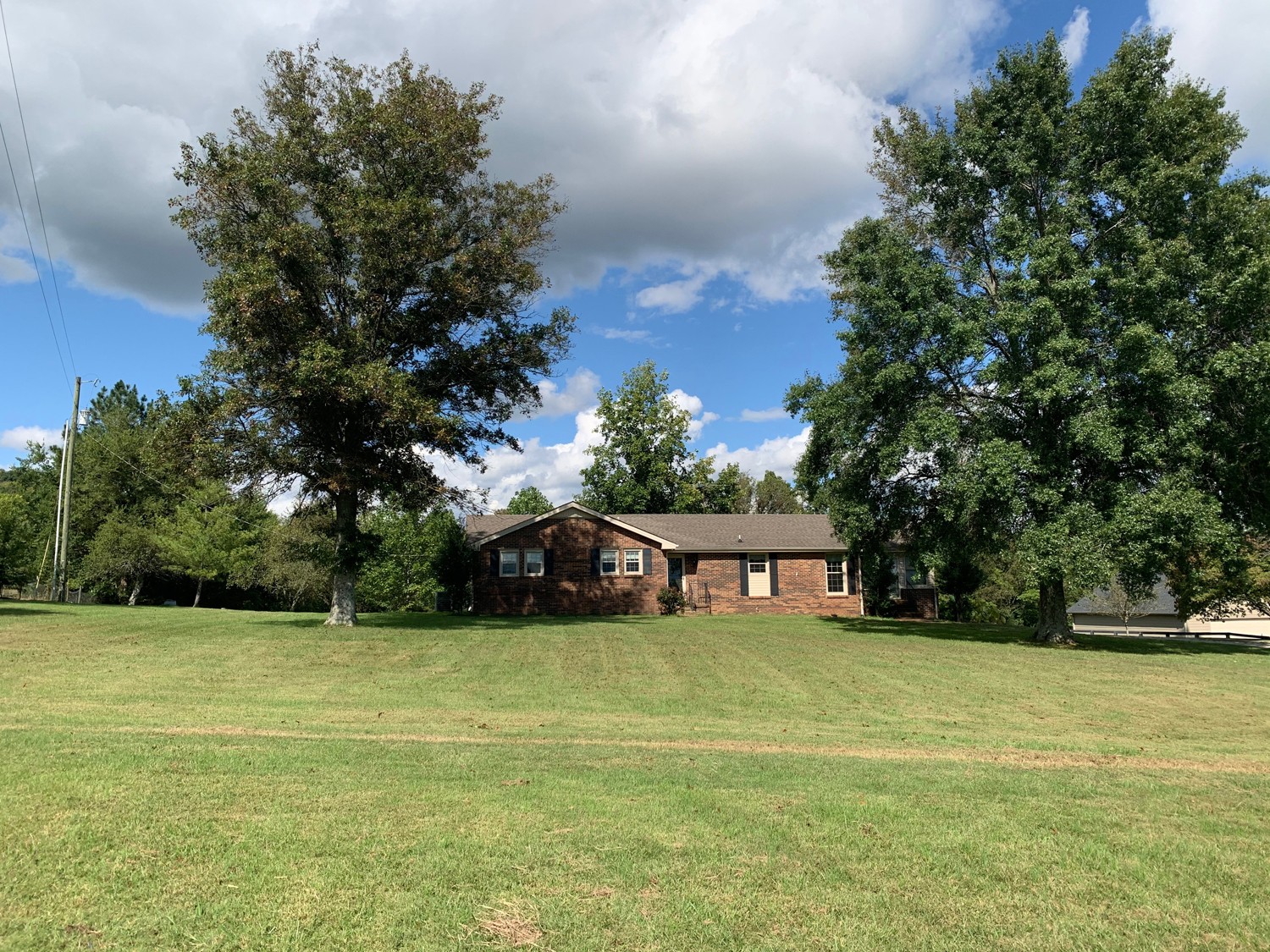 6438 Eudailey-Covington Road College Grove, TN 37046 - Photo 4 of 9 a view of a house with yard and trees