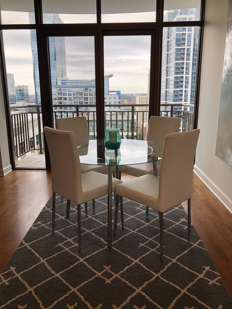 233 East 13th Street, Unit 2210 Chicago, IL 60605 - Photo 14 of 28 a dining room with furniture and wooden floor