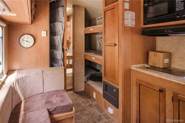 a bedroom with a bed and a television