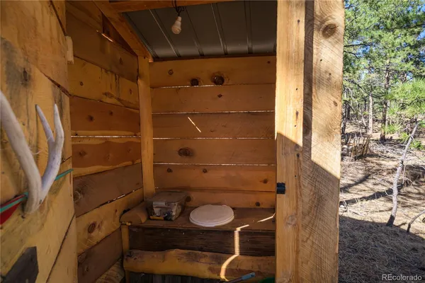 a bathroom with a toilet and shower