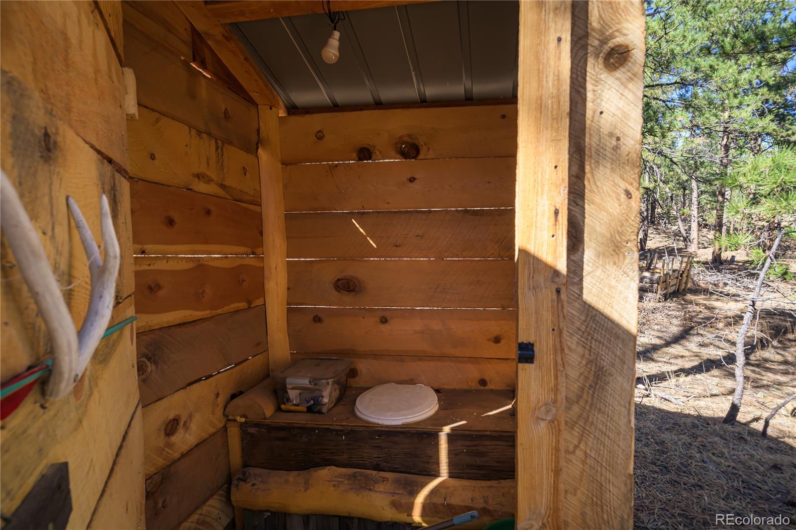 17990 King Road Weston, CO 81091 - Photo 24 of 49 a bathroom with a toilet and shower