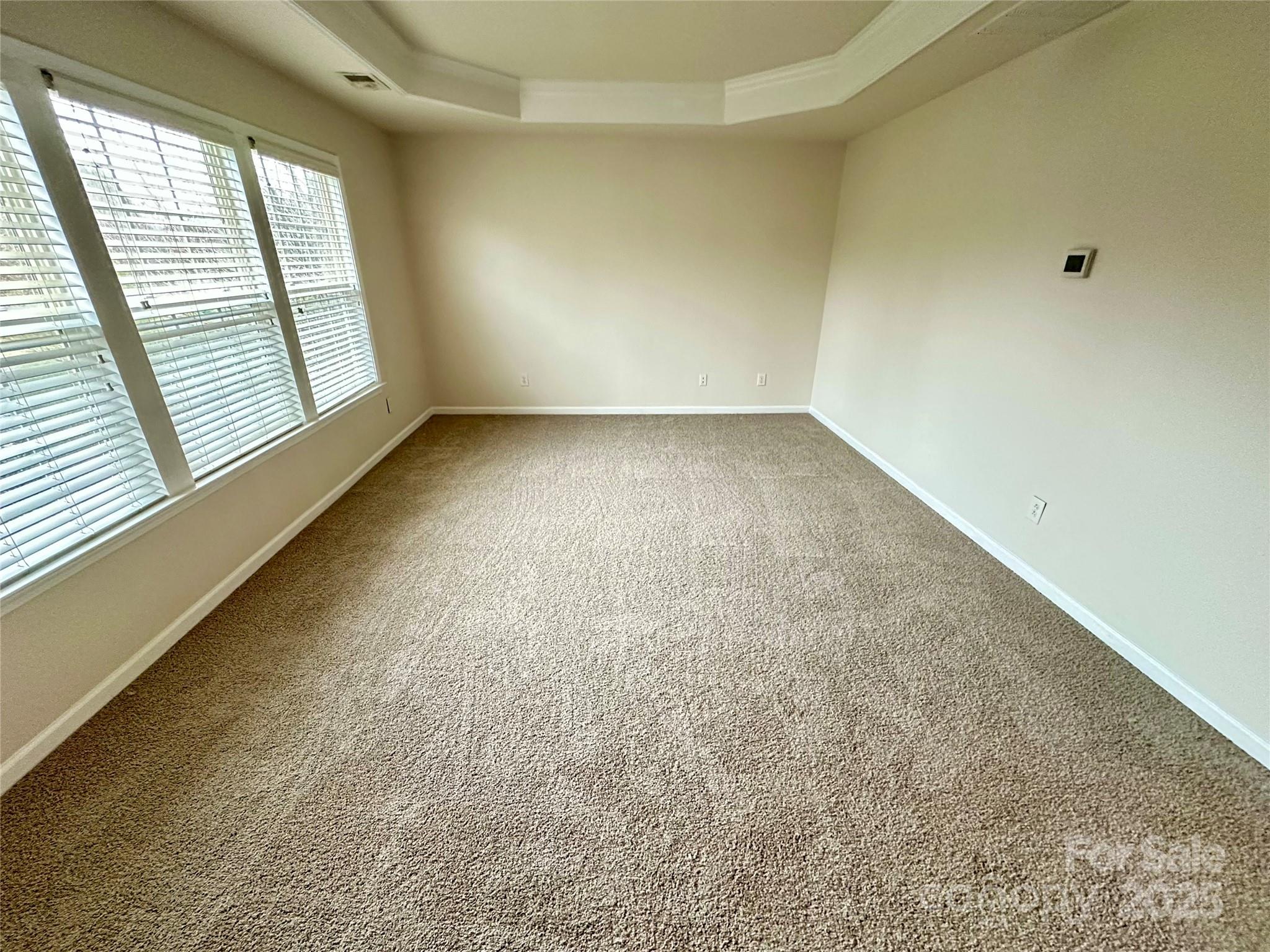 7633 Rathburn Lane Charlotte, NC 28277 - Photo 12 of 27 an empty room with windows