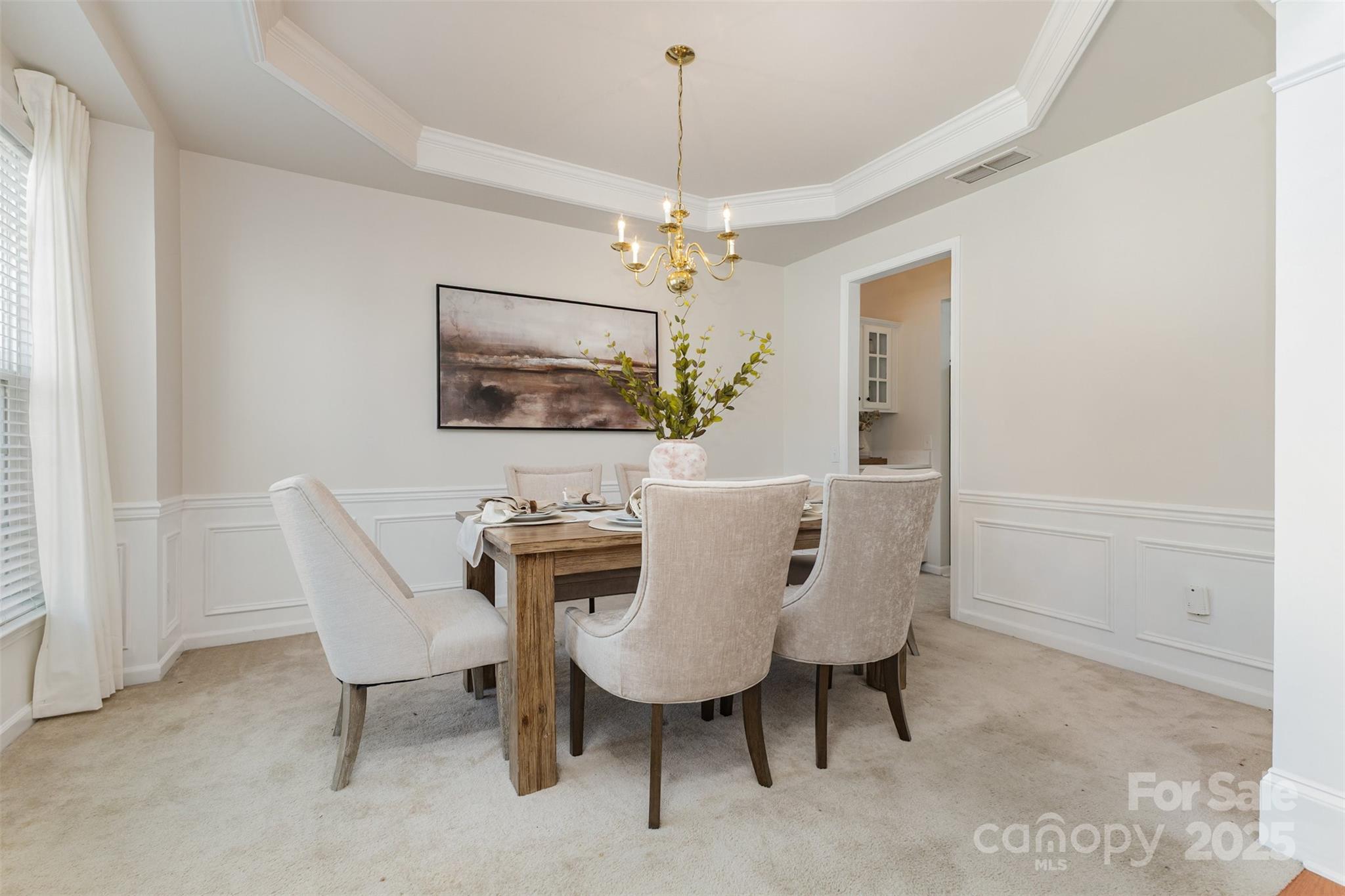 7633 Rathburn Lane Charlotte, NC 28277 - Photo 18 of 27 a view of a dining room with furniture and chandelier