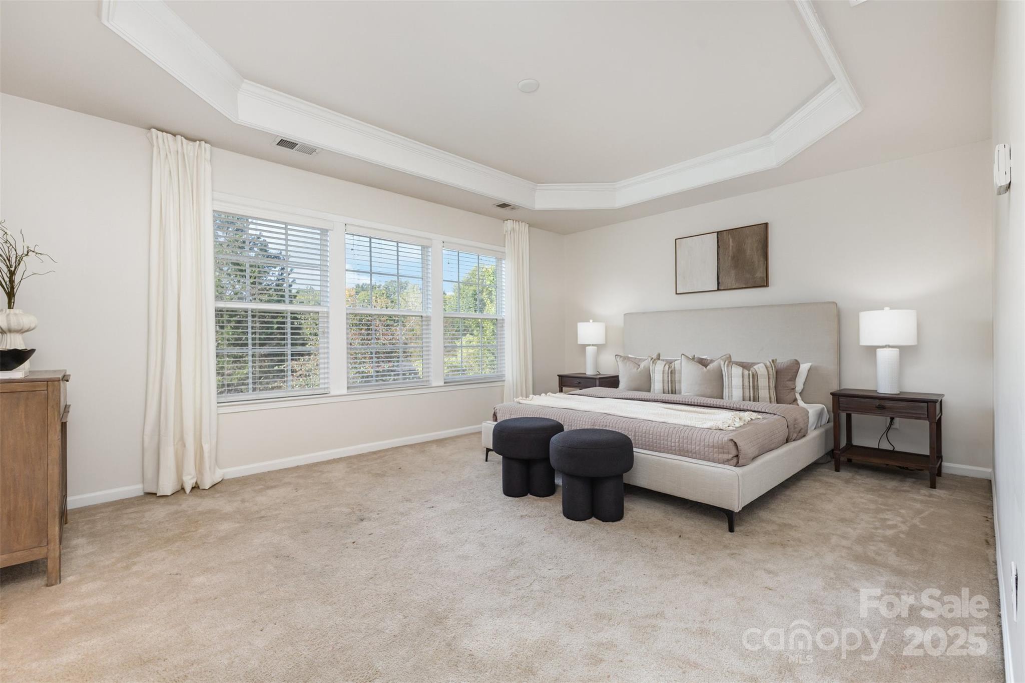 7633 Rathburn Lane Charlotte, NC 28277 - Photo 21 of 27 a spacious bedroom with a bed and a couch