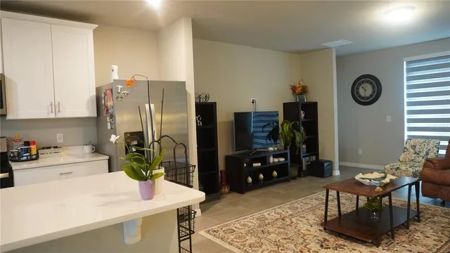 a kitchen with table and chairs