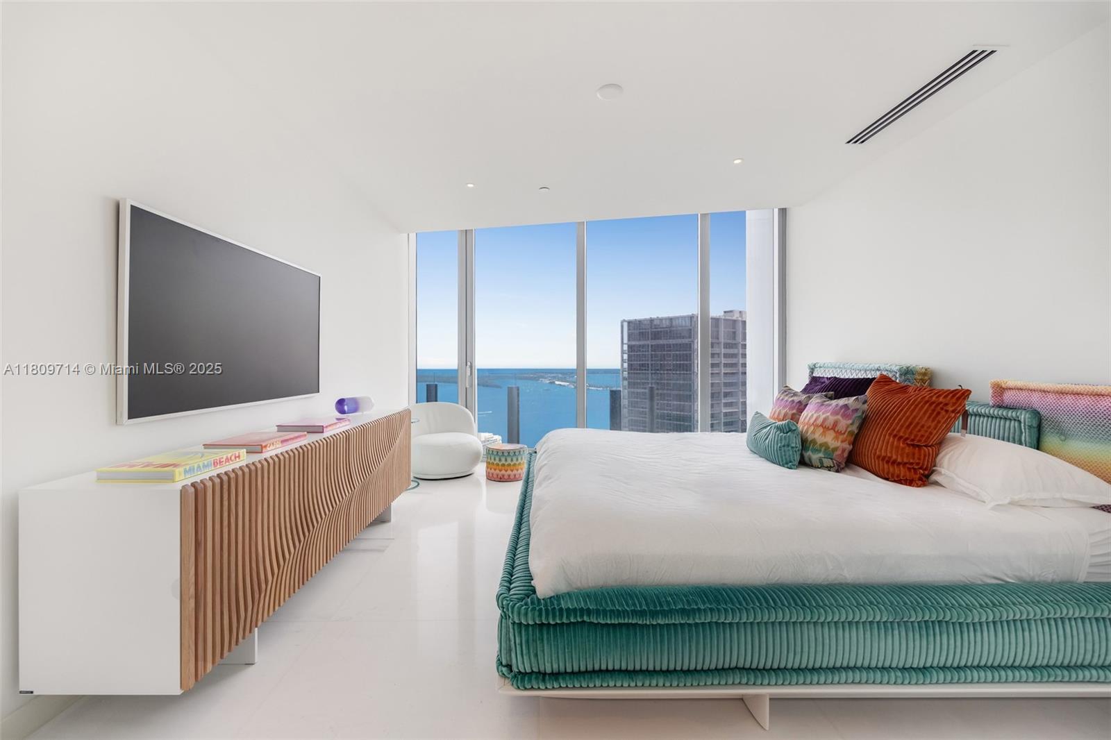 300 Biscayne Blvd Way, Unit 5205W Miami, FL 33131 - Photo 11 of 40 a bedroom with a bed and a flat screen tv
