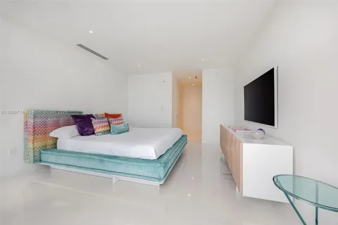 a bathroom with a sink a toilet and a shower