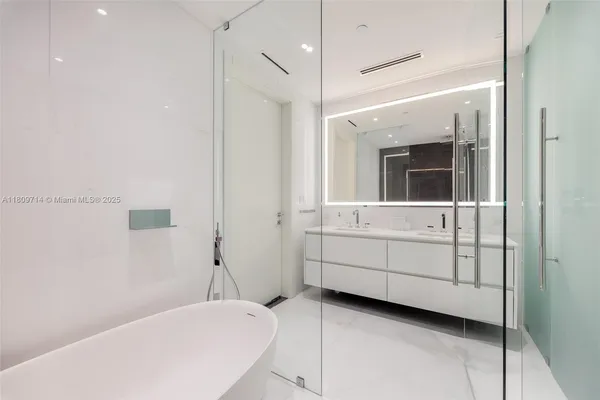 a bathroom with a sink and mirror