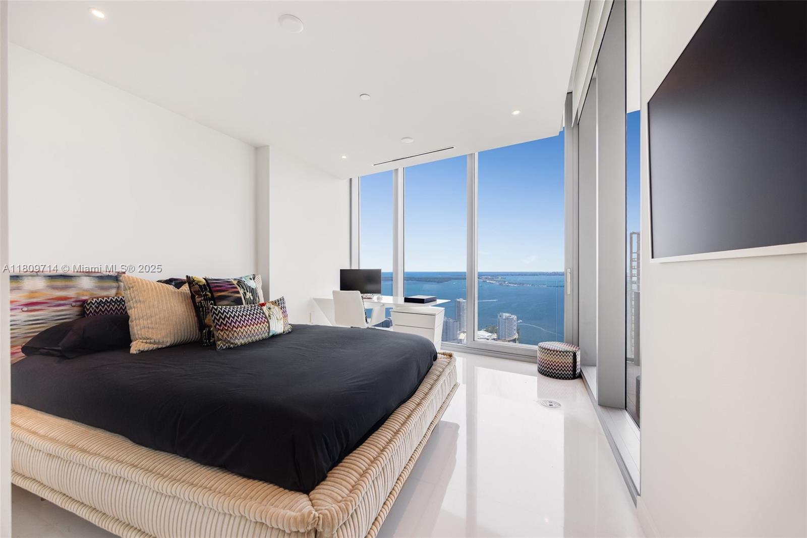 300 Biscayne Blvd Way, Unit 5205W Miami, FL 33131 - Photo 19 of 40 a bedroom with a bed and a large window