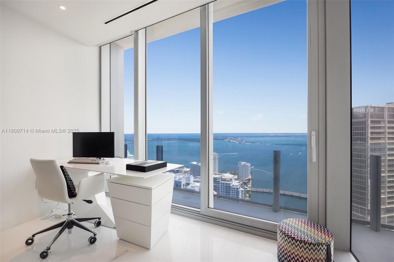 300 Biscayne Blvd Way, Unit 5205W Miami, FL 33131 - Photo 21 of 40 a room with a chair and white walls