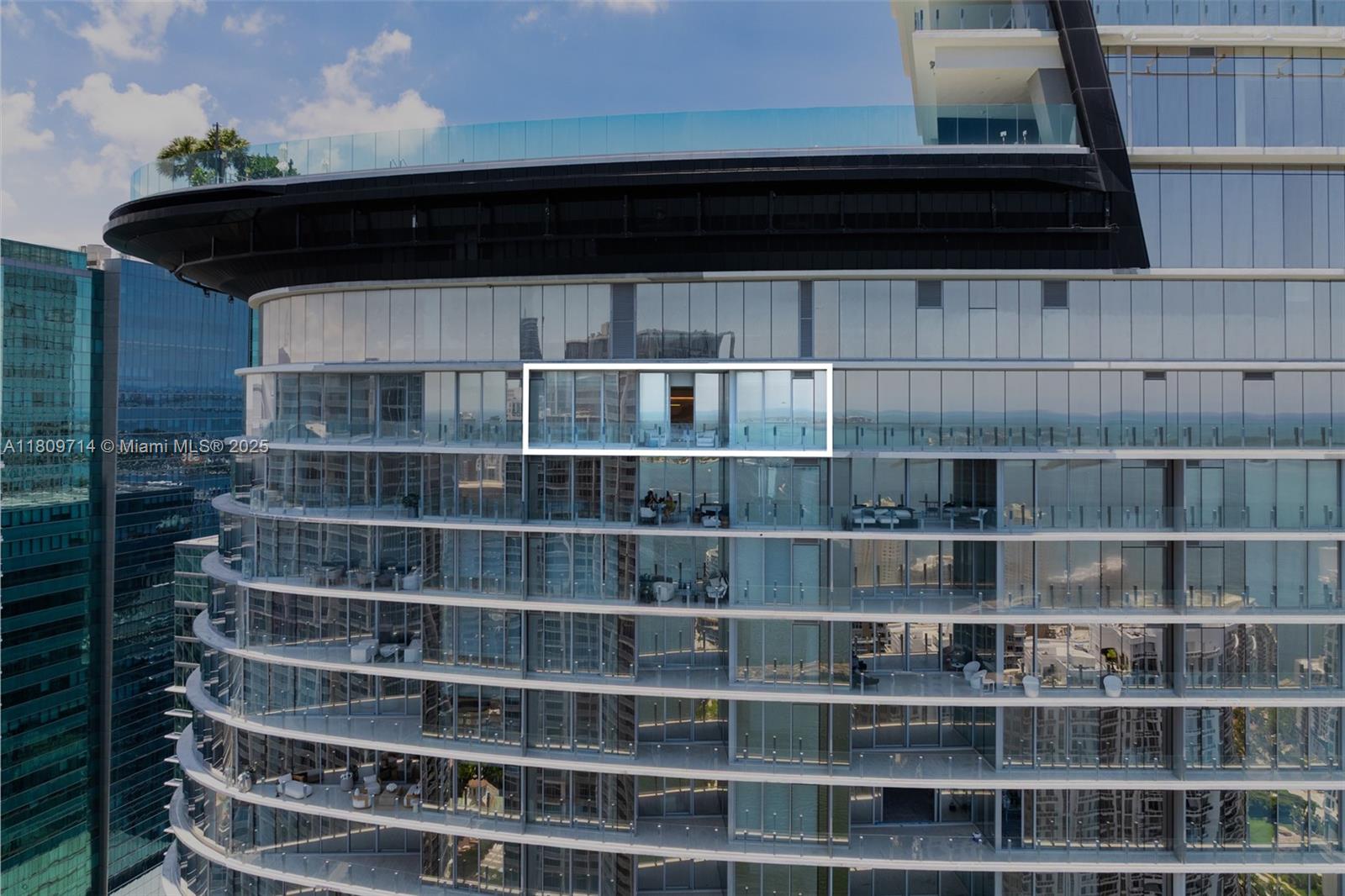 300 Biscayne Blvd Way, Unit 5205W Miami, FL 33131 - Photo 3 of 40 a view of a living room with a wooden shelf with a book shelf