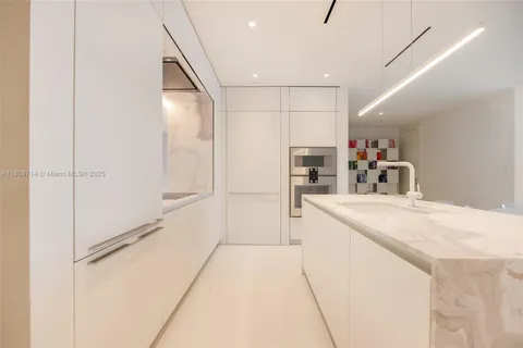 a living room with furniture and white walls