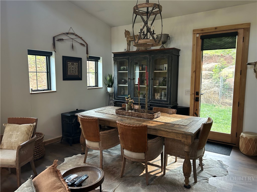 509 Grant Houck Road Todd, NC 28684 - Photo 25 of 43 a view of a dining room with furniture window and wooden floor