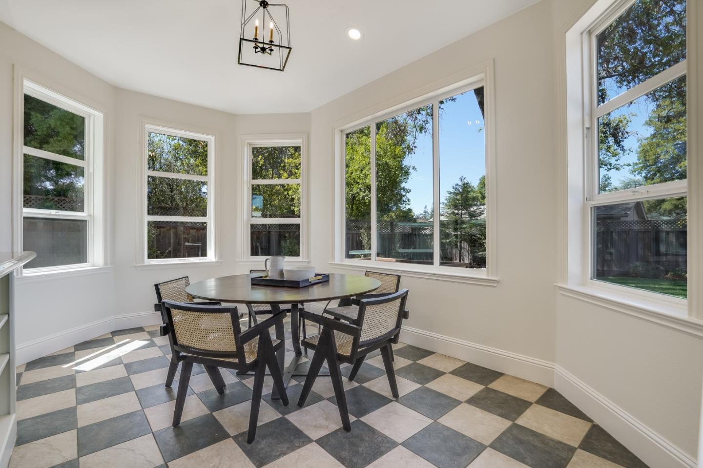 1161 Payne Drive Los Altos, CA 94024 - Photo 16 of 48 a dining room with a window and chairs