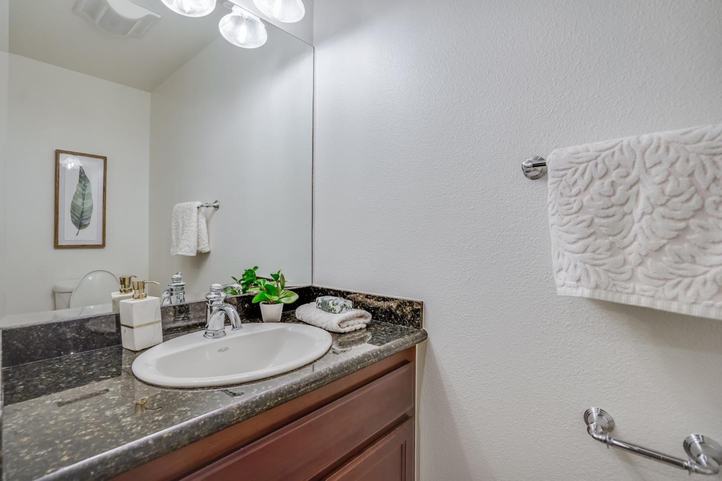 1161 Payne Drive Los Altos, CA 94024 - Photo 26 of 48 a bathroom with a granite countertop sink and a mirror