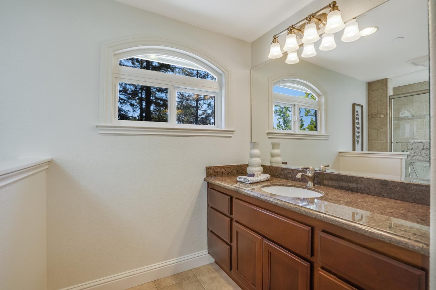 1161 Payne Drive Los Altos, CA 94024 - Photo 34 of 48 a bathroom with a granite countertop sink and a mirror