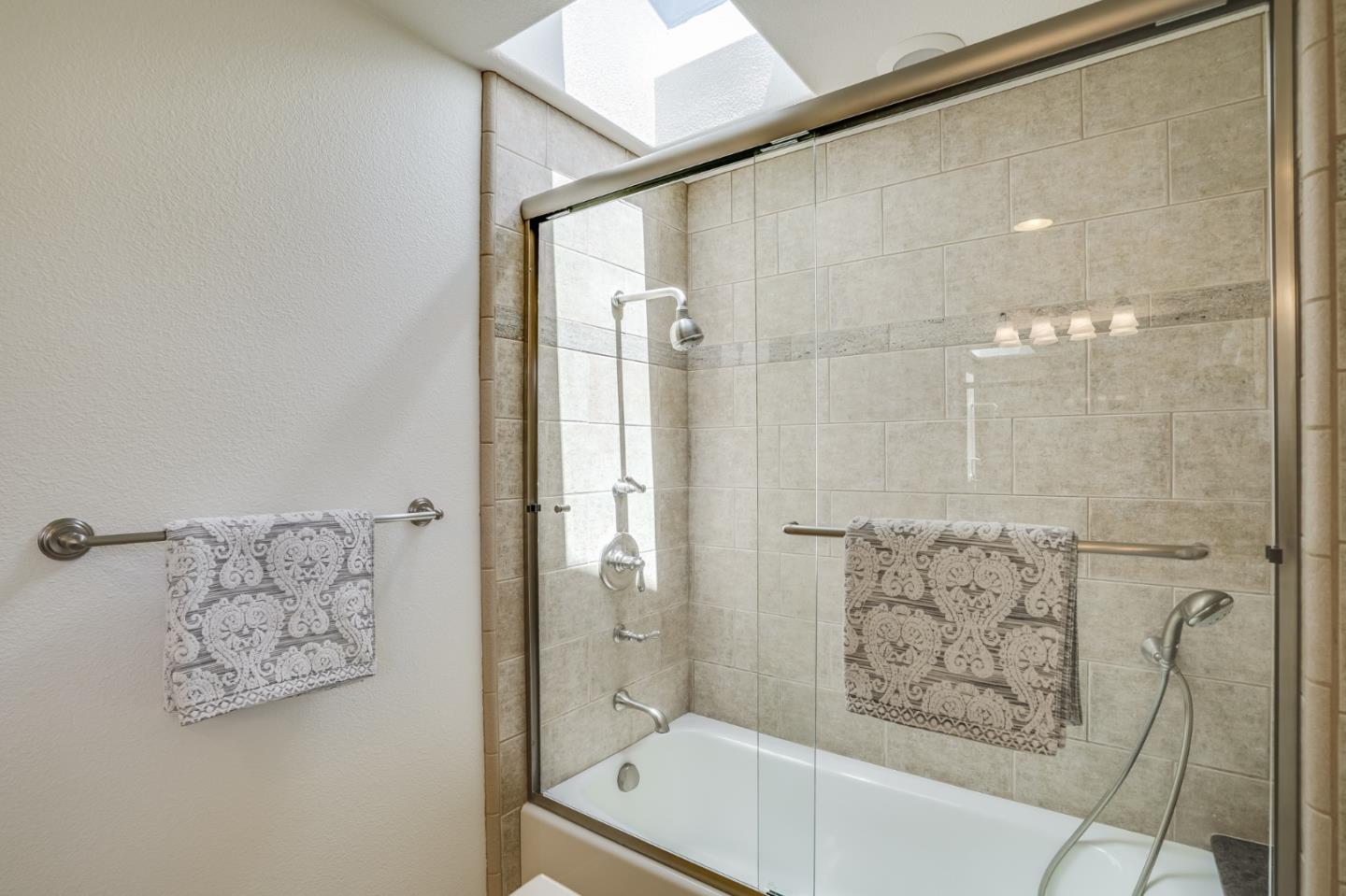 1161 Payne Drive Los Altos, CA 94024 - Photo 35 of 48 a bathroom with a bathtub and shower