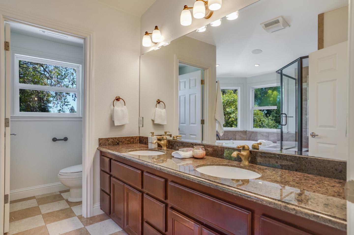 1161 Payne Drive Los Altos, CA 94024 - Photo 39 of 48 a bathroom with a granite countertop sink mirror and window