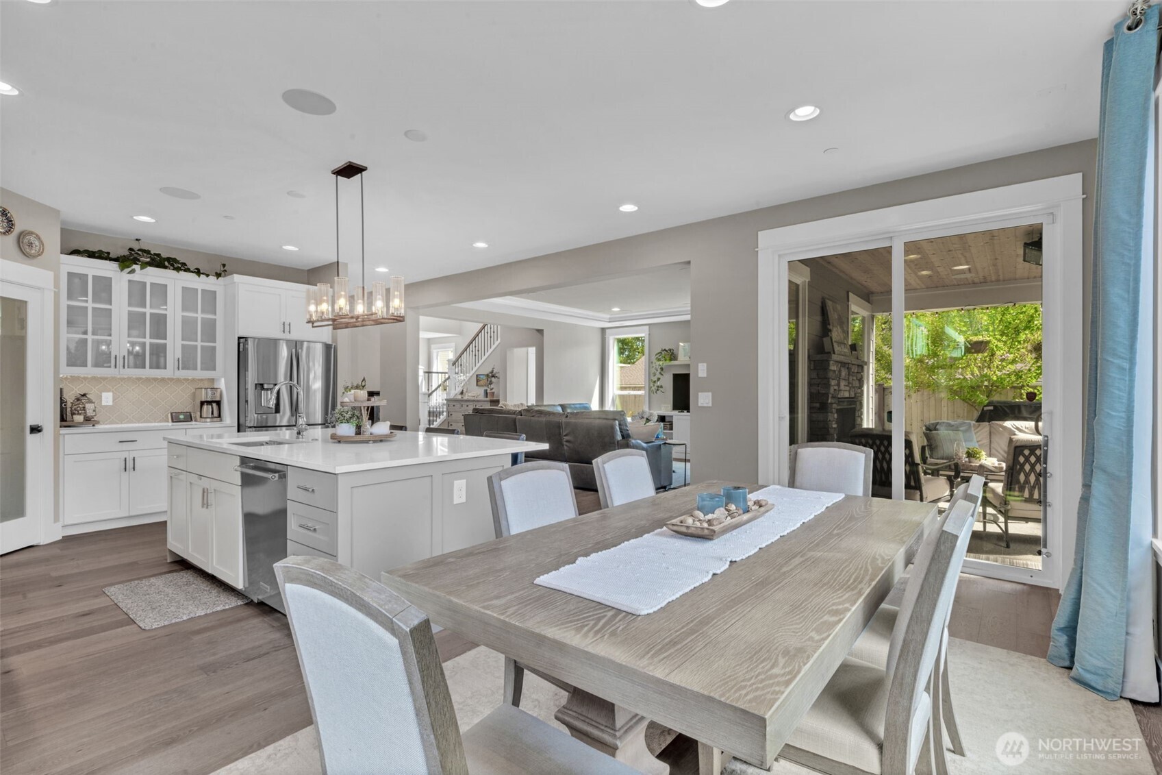 23216 9th Avenue Southeast Bothell, WA 98021 - Photo 13 of 40 a large kitchen with kitchen island a table and chairs in it