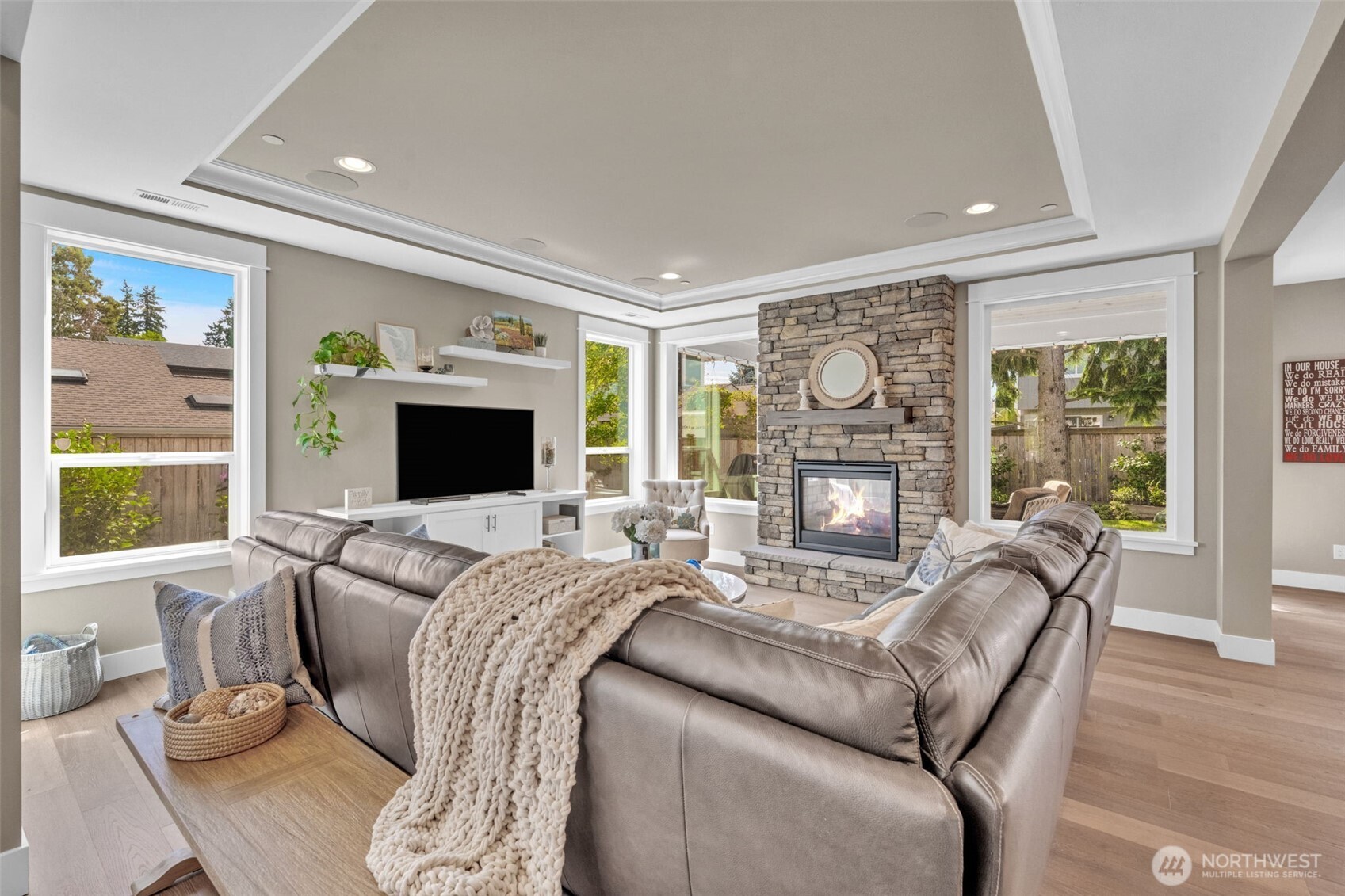 23216 9th Avenue Southeast Bothell, WA 98021 - Photo 15 of 40 a living room with furniture a flat screen tv and a fireplace