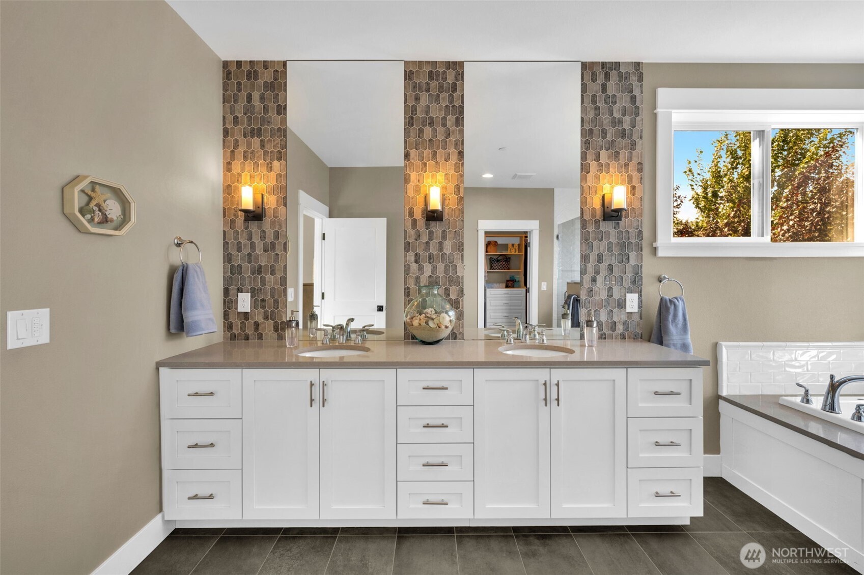 23216 9th Avenue Southeast Bothell, WA 98021 - Photo 24 of 40 a bath room with a sink and a large mirror