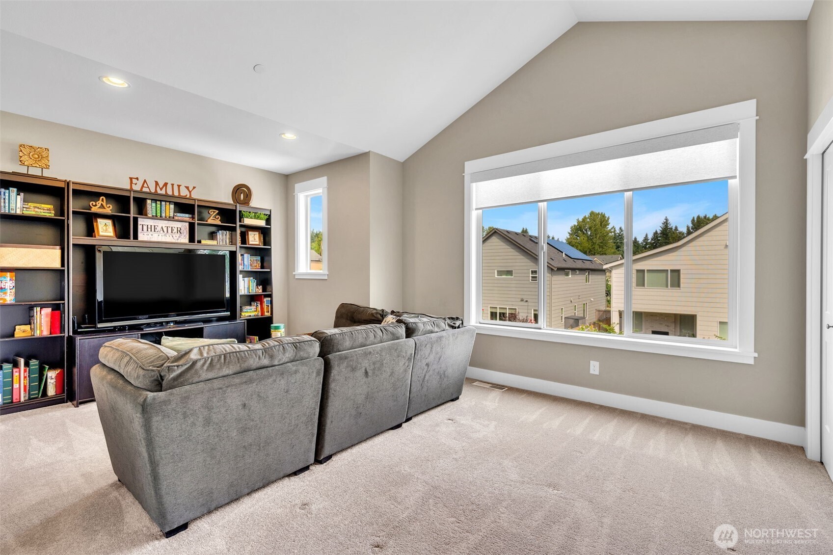 23216 9th Avenue Southeast Bothell, WA 98021 - Photo 28 of 40 a living room with furniture and a flat screen tv