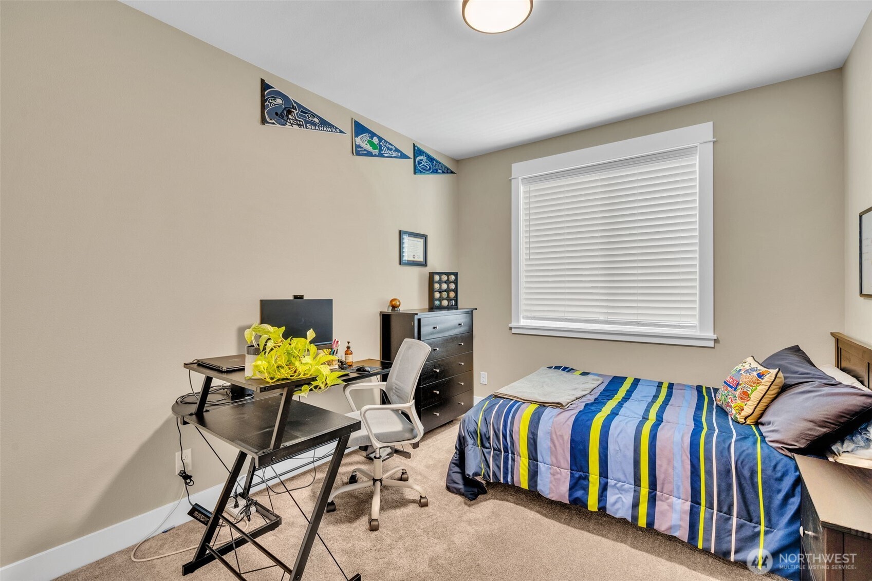 23216 9th Avenue Southeast Bothell, WA 98021 - Photo 32 of 40 a living room with a bed and a chair