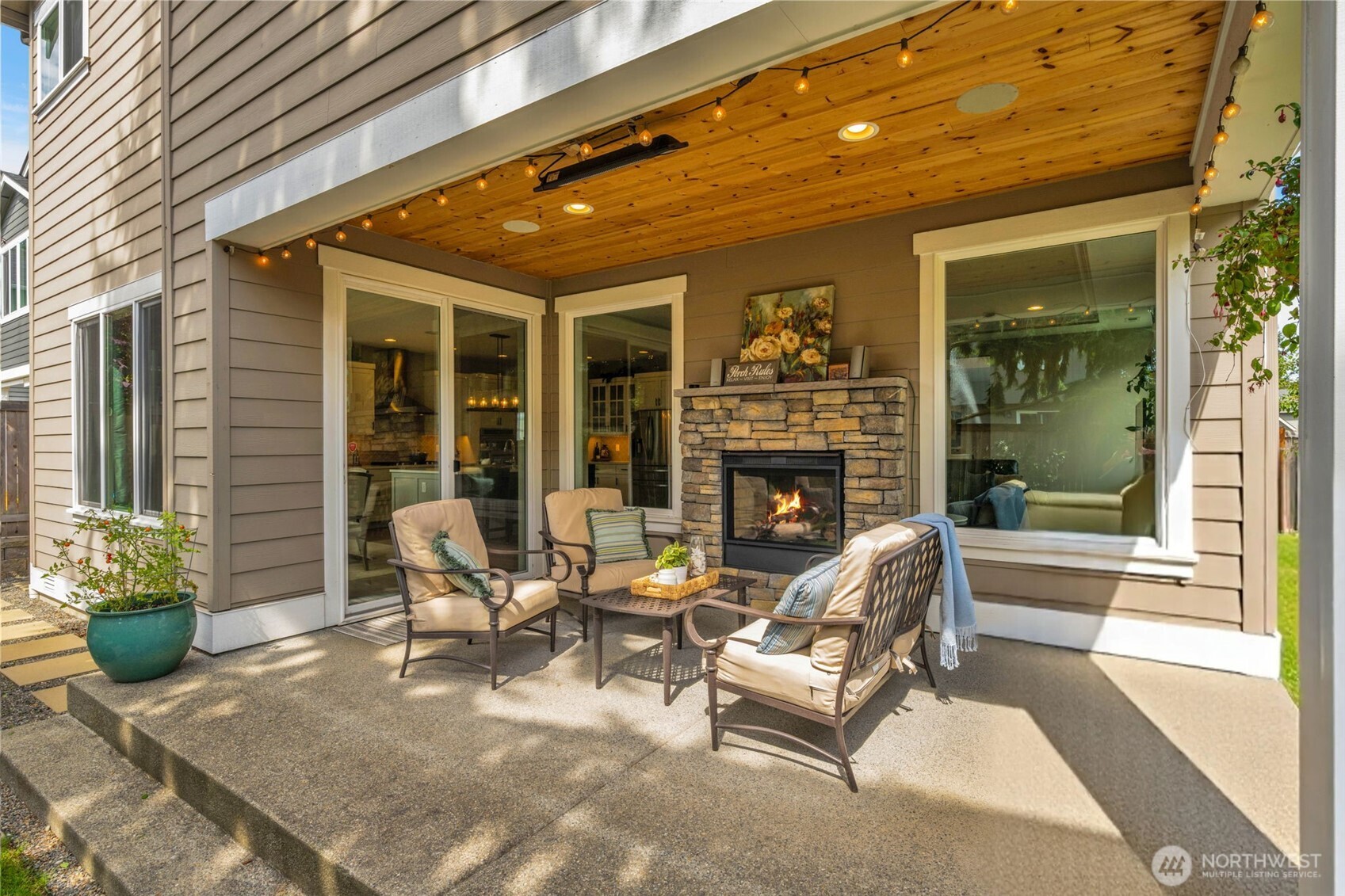 23216 9th Avenue Southeast Bothell, WA 98021 - Photo 37 of 40 a outdoor living space with patio furniture and a fireplace