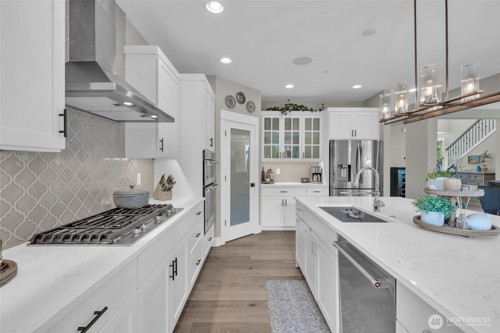 23216 9th Avenue Southeast Bothell, WA 98021 - Photo 4 of 40 a large kitchen with stainless steel appliances a sink a stove and cabinets
